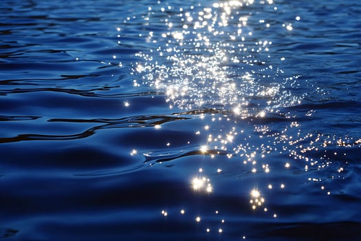 A bright light shining on the water photo