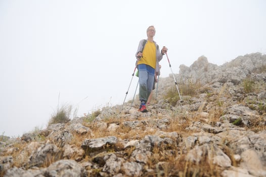 Senior Hikers Exploring Rocky Mountain Trails in Foggy Conditions photo
