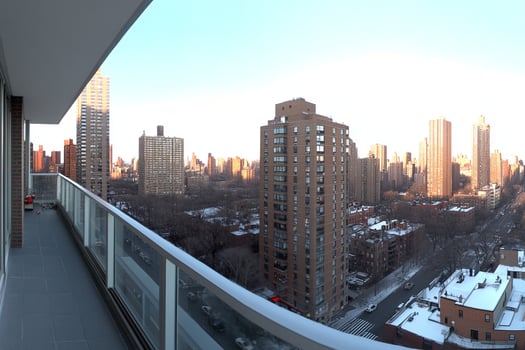 A balcony with a view of the city skyline photo