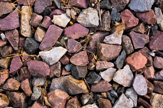 Multicolored gravel rocks with mixed textures and natural patterns photo