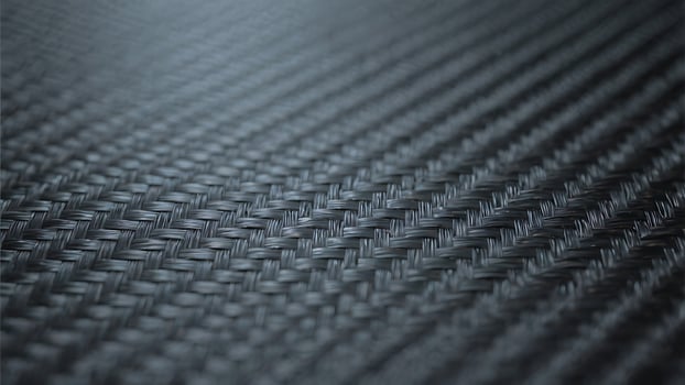 Abstract Dark Gray Carbon Fiber Weave Texture Background Close-up Detailed Macro Shot of Intertwined Fibers photo
