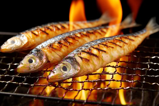 Three fish are cooking on a grill photo