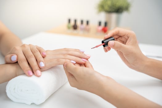 Woman receive care service professional Beautician Manicure at spa centre. Nail beauty salon use nail file for Glazing treatment. manicurist make nail customer to beautiful. body care spa treatment photo