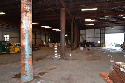 A large warehouse with a lot of equipment in it photo