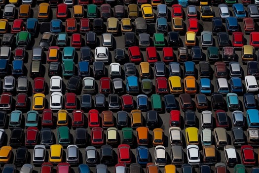 An aerial view of a parking lot full of cars photo
