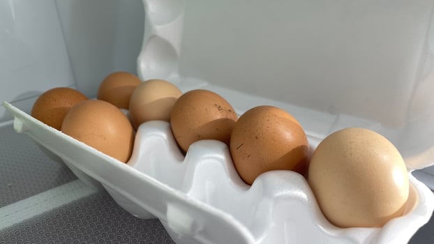 Eggs in a carton on a shelf photo