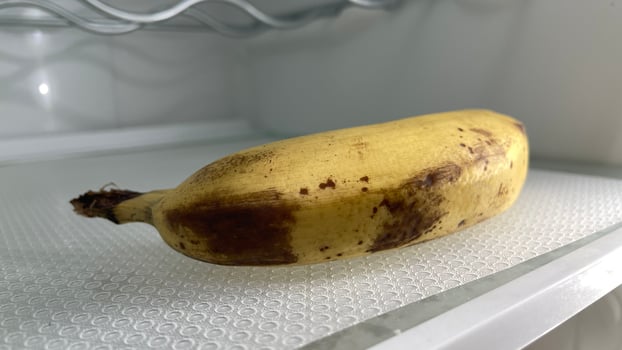 A banana sitting in a refrigerator photo