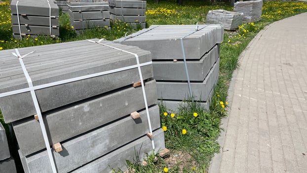 A group of concrete blocks sitting on the side of a road photo