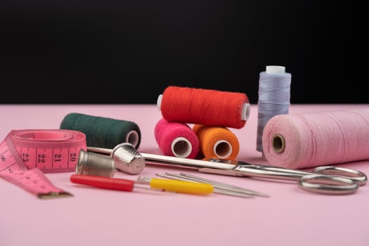 Sewing supplies with colorful threads and tools photo