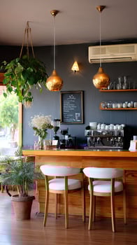 A bar with a wooden counter and two chairs photo