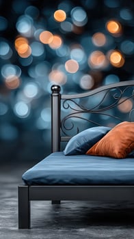 A bed with a blue and orange pillow photo