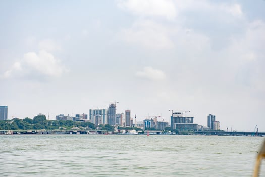 Modern skyline of Abidjan, View of the Plateau construction sites from the Ebrie lagoon photo