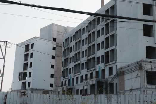 The site of abandoned construction characterized by incomplete and halffinished buildings photo