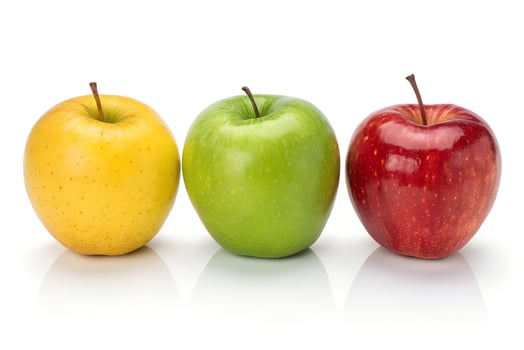 One Yellow Apple, One Green Apple, and One Red Apple on White Background photo