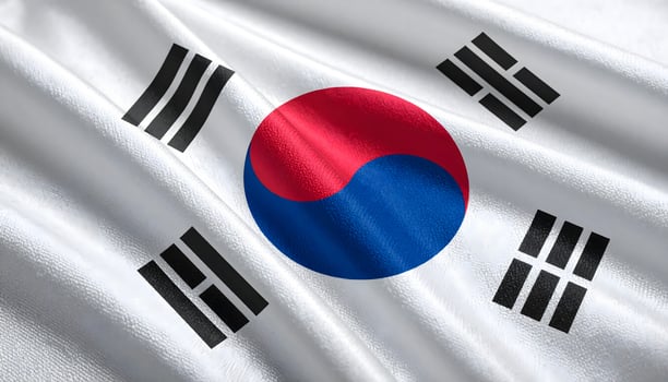 Close up of the waving flag of South Korea, the Taegeukgi. Realistic fabric texture with the Taegeuk symbol and trigrams. Symbol of Korean patriotism, culture, and politics. photo