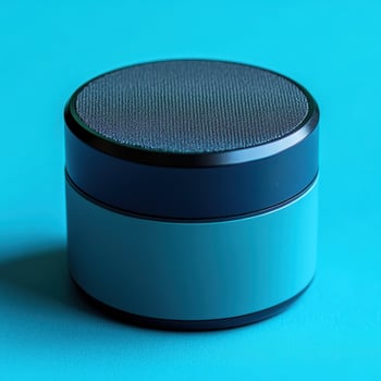 A blue and black speaker on a blue background photo