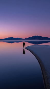 Man walking on water at Great Salt Lake during sunset photo