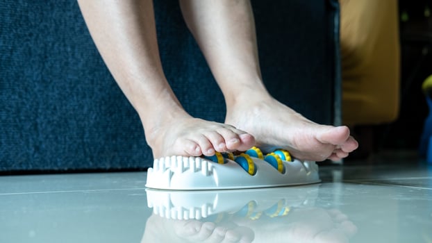 A woman legs in a foot massager, showing the struggle with foot pain and desire for comfort. photo