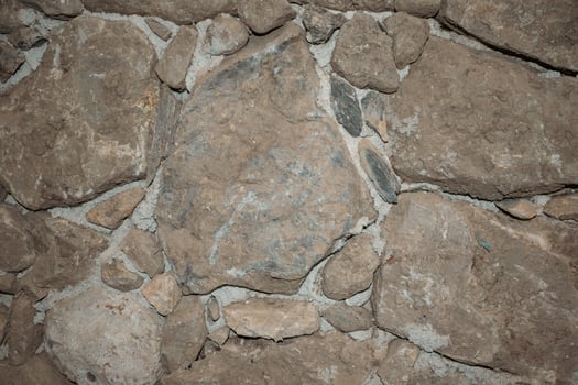 Unusual stone old masonry with rocks of different sizes. Natural textured background photo