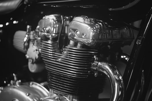 Powerful chrome engine of a custom motorcycle gleaming in black and white photo