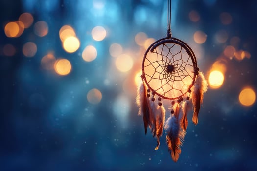 Dream catcher hanging on a blurred background with golden bokeh lights photo