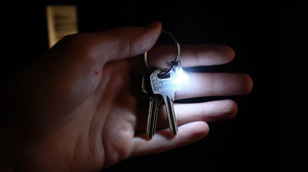 Keys in hand lit up photo