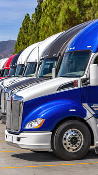 A row of semi trucks photo