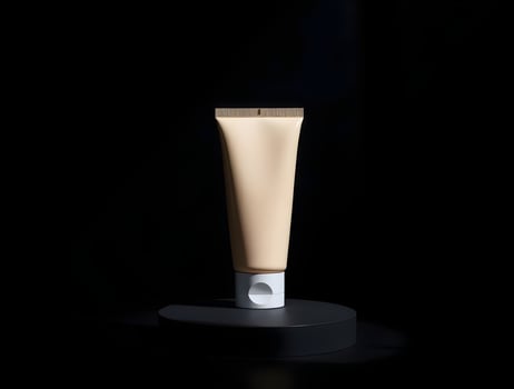 Beige Cosmetic Tube on Dark Background photo