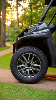 The front end of a black utv on a path photo