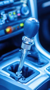 A car gear shift is shown in the center of the vehicle photo