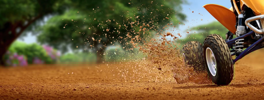 A dirt bike is riding on the dirt photo