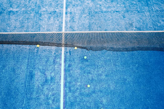 overhead perspective of an empty blue sports court with game equipment photo