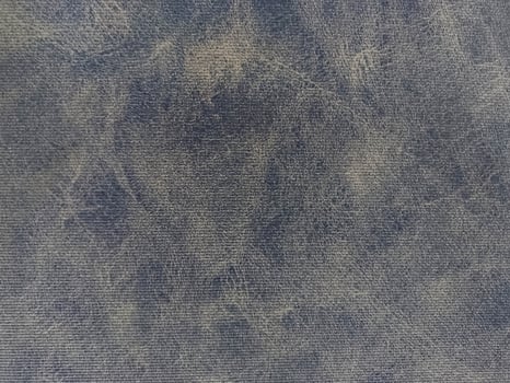 Distressed Fabric Surface with Uneven Texture and Dark Washed Tones photo