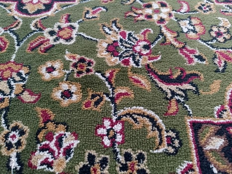Hand made green carpet pattern design photo