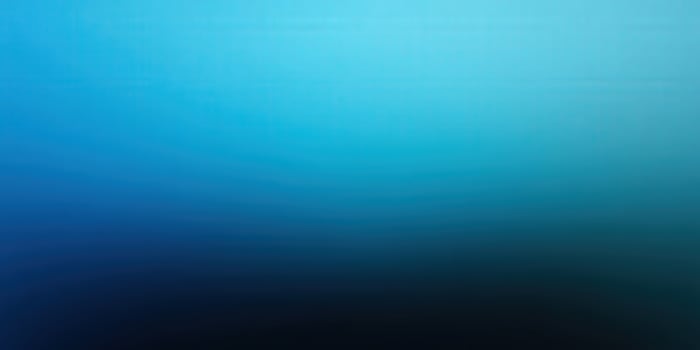 A smooth, vibrant blue gradient creates a calming and visually appealing background. photo