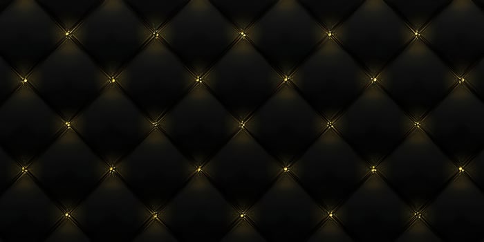 Detailed view of a luxurious black leather diamond-patterned upholstery, perfect for backgrounds. photo