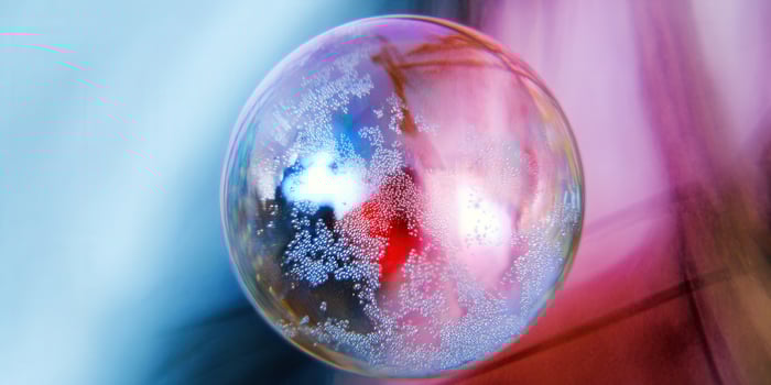 A captivating shot of a soap bubble displaying beautiful iridescent colors and reflections. photo