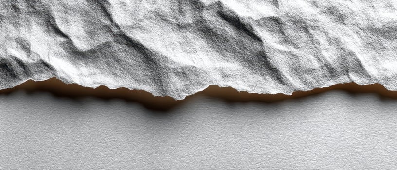 Textured white paper with torn edge and shadow photo