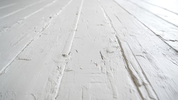 A white painted wooden floor with a white paint photo