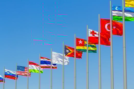 flags of countries against blue sky photo