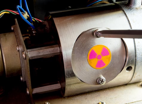 To open the cover of Radioactive container in the part of machinery photo