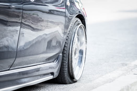 A close up of a car tire on the road photo
