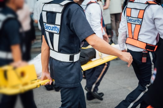 A group of people walking with a stretcher photo