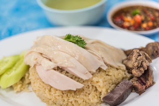 A plate with rice, chicken and vegetables photo