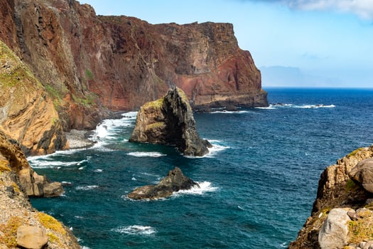 Rocky wavy ocean coast with islands landscape of Madeira photo