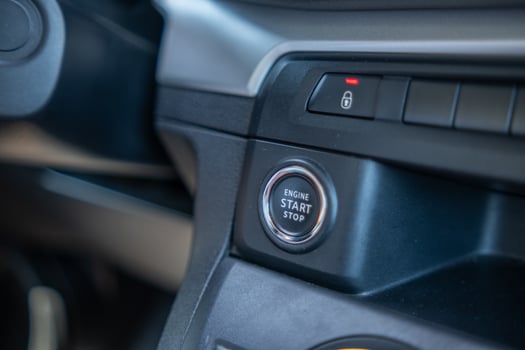 Close-up View of an Ignition Button in a Vehicles Interior During a Bright and Sunny Day photo
