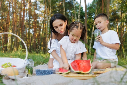 Family Picnic with Kids Eating Watermelon Outdoors, Summer Day, Healthy Lifestyle, Fresh Fruit photo