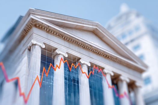 Declining graph showing financial crisis affecting government building photo