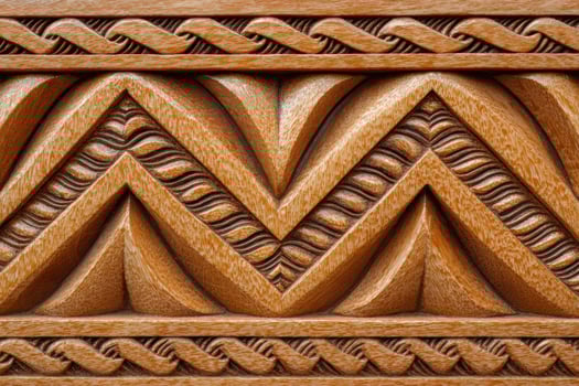 Polynesian pattern carved in light brown wood creating a beautiful texture photo