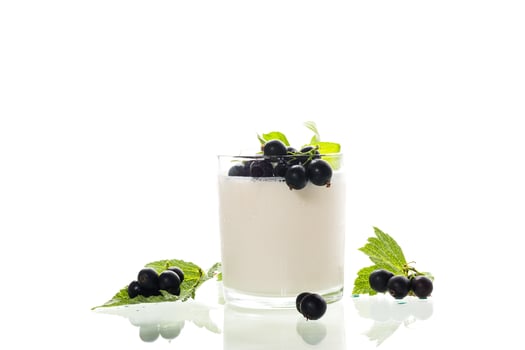 Sweet homemade yogurt with berries on white background. photo